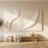 A flawless high-end plaster artwork with smooth, confident relief and clean edges in ivory, hanging in a calm, bright room